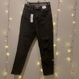 Top shop high waist tapered leg black charcoal mom jeans with rip. Size 27